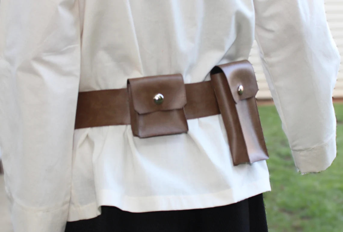 Back view of adult Luke Skywalker costume belt — wide brown leather belt with one snap square pouch and one long regtangle snap pouch worn over a cream tunic