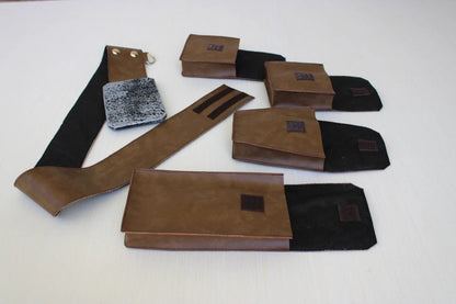 Complete Luke Skywalker adult costume belt set laid flat — brown leather belt with distressed silver buckle with velcro clousure, 2 silver snaps a D-ring attached and four snap pouches