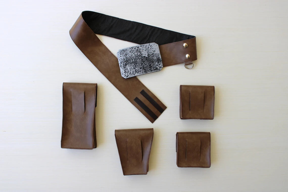 Back view of Luke Skywalker adult costume belt set unensambled — brown leather belt with distressed silver buckle one regtangular pouch one triangular pouch and 2 square pouches with open-slot laid flat on white background