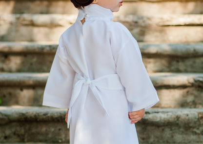 Close-up back detail of handmade Princess Leia kids costume — white robe with tied belt and button closure at neckline